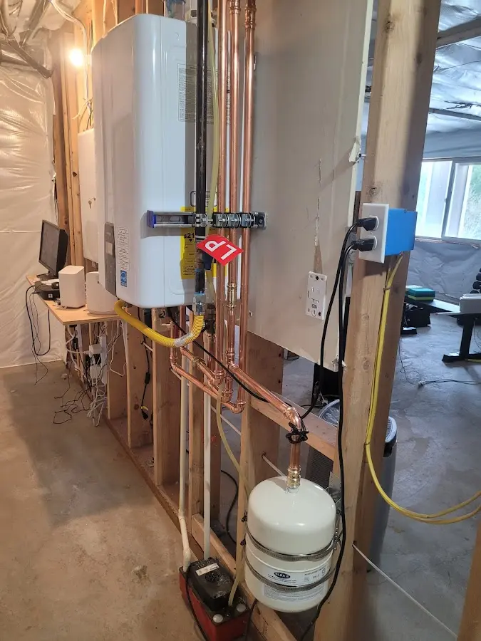 Licensed plumber repairing a kitchen sink in Springville